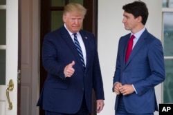 Kanada Başbakanı Justin Trudeau Cuma günü yaptığı açıklamada, Trump'ın gümrük vergilerini uygulamaya koyması durumunda Kanada'nın bir yanıt vermeye hazır olduğunu söyledi, ancak ayrıntı vermedi. (Fotoğraf: 20 Haziran, 2019)